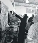  ?? Culture and Youth Ministry of ?? Noura Al Kaabi at the experiment­al artist Mohamed Ahmed Ibrahim’s studio in Khor Fakkan