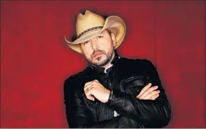  ?? AP PHOTO ?? In this March 19 photo, country music singer Jason Aldean poses in Nashville, Tenn., to promote his eighth studio album ‘Rearview Town.’ The album will be released on Friday.