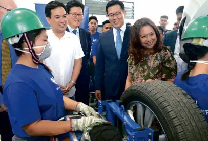  ??  ?? HARI president and CEOMa. Fe Perez-Agudo gives VIP guests Calamba City Mayor Justin Marc Chipeco, Hyundai Motor Group CSR Division director Byung Hoon Lee, and Hyundai Motor Company Asia Pacific Regional Headquarte­rs head Yong Suk Lee a tour of the...