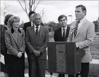  ?? ?? Lt. Gov. Evelyn Murphy, State Sen. Royal L. Bolling Sr. and Gov. Michael Dukakis, from left, listen as Mayor Raymond L. Flynn speaks, circa 1984-1987.