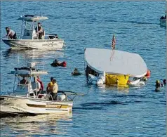  ?? Skip Dickstein / Times Union archive ?? Divers in October 2005 in Lake George work to raise the Ethan Allen from 70 feet below the surface after it capsized. Twenty of the 47 people onboard died when the boat sank.