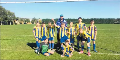  ??  ?? John Dentice, back centre, with his team the KCU Thunder.