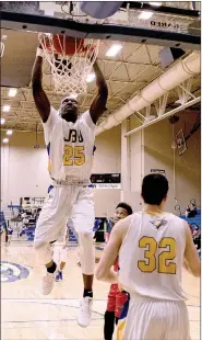  ?? Photo courtesy of JBU Sports Informatio­n ?? John Brown University junior Sam Egedi goes up for a two-handed dunk as a part of a 10-0 JBU run during the second half Thursday against Bacone. JBU defeated the Warriors 106-70 at Bill George Arena. The Golden Eagles played at Mid-America Christian on...