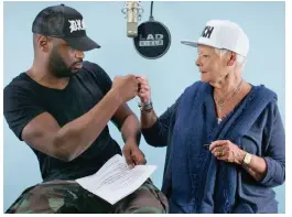  ??  ?? Respect: Bizzle is impressed by Dame Judi’s rhymes