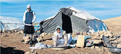  ??  ?? Driven out by Islamic jihadists, the Yazidi are forced to live in tents on Mount Sinjar in northern Iraq