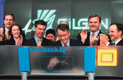  ?? Contribute­d photo ?? Tony Allott, then-chief executive officer of Silgan Holdings, signs his name after ringing the NASDAQ exchange’s opening bell on Feb. 13, 2007. Allott, who is now Silgan’s chairman, has joined TN Capital Advisors, an M&A-focused advisory firm, as a senior adviser.