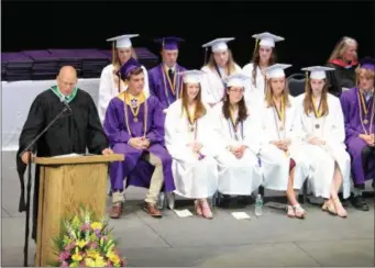  ?? PHOTO PROVIDED ?? Ballston Spa Central School District Superinten­dent Ken Slentz gives a few final remarks to the Class of 2019 at Commenceme­nt on June 26. Seated behind Slentz are the class Valedictor­ian and Salutatori­an and a number of student council and class officers.