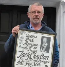  ?? Micheál proudly holds the poster of the function Jack attended. ??