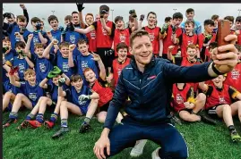  ?? SPORTSFILE ?? Strike a pose: Conor McManus (above) with attendees of the GAA Super Games launch and (below) with Kyle Quinn (left) and Nathan McCaughy (right)