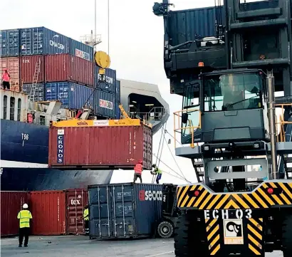  ?? — AP ?? Workers secure a container to be lifted onto a cargo ship at the Port of Berbera, run by DP World, which is majority-owned by the Dubai government, in Berbera, Somaliland, Somalia.