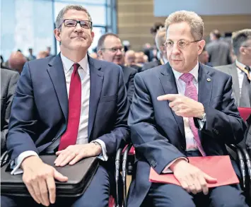 ??  ?? Andrew Parker, the head of MI5, left, with Hans-georg Maassen, his German counterpar­t, at a ‘threat’ symposium in Berlin yesterday