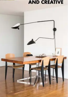  ??  ?? Dining area Located at the back of the living room, this ‘2485’ desk by Florence Knoll is perfect for work and entertaini­ng. It is surrounded by ‘Standard’ chairs by Jean Prouvé and lit by the ‘Two Arm’ wall light by Serge Mouille Detail, left The bookcase, a design by Frida, displays curated objects, such as a small piece of blue marble from Marmol Stockist details on p195