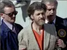  ?? John Youngbear/Associated Press ?? Theodore “Ted” Kaczynski is flanked by federal agents as he is led to a car from the federal courthouse in Helena, Mont., April 4, 1996.