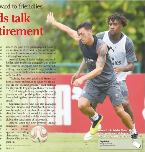  ?? Photo: VCG ?? Arsenal midfielder Mesut Ozil takes part in a training session on Wednesday in Singapore.