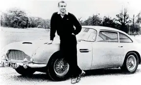  ??  ?? Sean Connery alongside an Aston Martin DB5 in the 1964 Goldfinger Bond film.