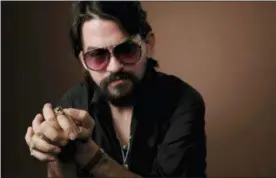  ?? PHOTO BY CHRIS PIZZELLO — INVISION — AP ?? In this photo, singer-songwriter Shooter Jennings, son of iconic country musicians, Waylon Jennings and Jessi Colter, poses for a portrait in Los Angeles.