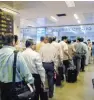  ?? - Bloomberg ?? CONSISTENT GROWTH : Passengers wait for their security inspection and clearances at Chhatrapat­i Shivaji Internatio­nal Airport in Mumbai. India’s domestic air passenger traffic stood at 100m in 2016.