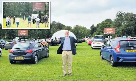  ??  ?? The Rev Jonathan Jee at the drive-in service in Kenilworth, where hundreds of people took part at the weekend