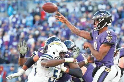  ?? GEOFF BURKE/USA TODAY SPORTS ?? The Ravens made offseason moves to ensure that quarterbac­k Lamar Jackson, right, continues to grow and thrive next season.