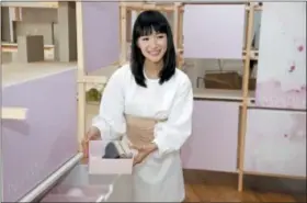  ?? PHOTOS BY SETH WENIG — THE ASSOCIATED PRESS ?? In this July 11, 2018 photo, Japanese organizati­onal expert Marie Kondo introduces her new line of storage boxes during a media event in New York. Kondo is launching the product line, a six-piece set of colorful and sturdy paper boxes, for $89.