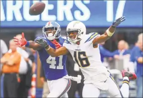  ?? Ed Mulholland / Associated Press ?? Giants cornerback Dominique Rodgers-Cromartie, left, breaks up a pass intended for Chargers wide receiver Tyrell Williams in Sunday’s game in East Rutherford, N.J.