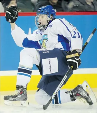  ?? Ted Rhodes/Calgary Herald ?? Jesse Puljujarvi of Finland U17 celebrates with flair after the Fins opened the scoring in the championsh­ip game of the Mac’s AAA Midget Hockey Tournament Wednesday against Switzerlan­d U17.