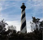  ?? SUSAN SHARP/DETROIT FREE PRESS ?? The spiralling black andwhite stripes of the Cape Hatteras lighthouse is the iconic symbol of theOuter Banks, the 100-mile chain of islands that sit a fewmiles offffthe North Carolina coast.