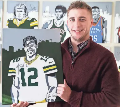  ?? RICK WOOD / MILWAUKEE JOURNAL SENTINEL ?? Ben Erickson of Whitefish Bay shows off his signed portrait of Green Bay Packers quarterbac­k Aaron Rodgers. He paints the portraits as a way to get athletes’ attention to get their autographs. For more photos and a video, go to jsonline.com/news.