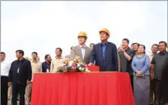  ?? FACEBOOK ?? Chinese Ambassador Xiong Bo stands with Prime Minister Hun Sen at the groundbrea­king of a China-backed bridge on Friday.