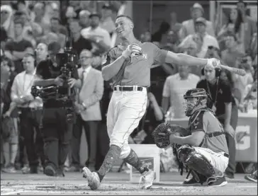  ?? The Associated Press ?? HAPPY VERDICT: Yankees rookie Aaron Judge hits 47 home runs, the longest at 513 feet, and outhits Minnesota’s Miguel Sano 11-10 to win the MLB All Star Home Run Derby Monday night in Miami.