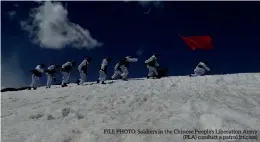  ??  ?? FILE PHOTO: Soldiers in the Chinese People’s Liberation Army (PLA) conduct a patrol (rt.com)