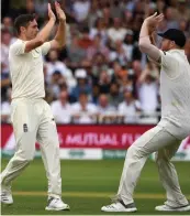  ?? — AFP ?? England’s Chris Woakes ( left) celebrates with Ben Stokes after taking a wicket on Saturday.