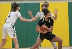  ?? Emily Matthews/Post-Gazette ?? Quaker Valley’s Corinne Washington holds onto the ball against Blackhawk on Monday at Blackhawk High School in Beaver Falls. Quaker Valley won, 63-51.