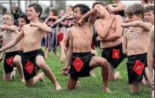  ??  ?? Above, Jared Opsima, centre, performs for Prime Minister Jacinda Ardern at West Spreydon School. At left, Kathy Oliver wears Ardern’s coat at West Spreydon School.