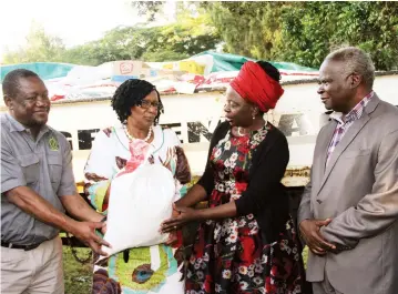  ??  ?? Environmen­t, Tourism and Hospitalit­y Industry Minister Prisca Mupfumira (centre) and Zimparks Director General Mr Fulton Mangwanya (left) hand over a donation towards Cyclone Idai victims to Public Service, Labour and Social Welfare Minister Sekai Nzenza, while Local Government, Public Works and National Housing Minister July Moyo (right) looks on in Harare yesterday. — (Picture by Edward Zvemisha)