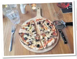  ??  ?? The Hare and Hounds in Levens, Cumbria. Inset: one of the four bedrooms, which are all named after the pub’s previous owners, and, the smoked pork belly, black pudding, apple and caramelise­d onion classic pizza