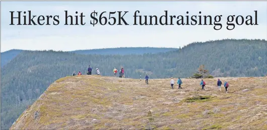  ?? LOUIS POWER PHOTOS/THE TELEGRAM ?? Hikers descend from The Gaze in Ferryland during the 16th annual Tely Hike Saturday.