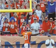  ?? AP PHOTO ?? LET’S HEAR IT: Aqib Talib celebrates a pick-6 to finish off the Broncos’ win over the Cowboys.