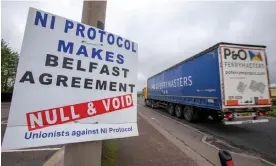  ?? Photograph: AFP/Getty ?? A lorry passes a sign near the port of Larne condemning the Northern Ireland protocol.