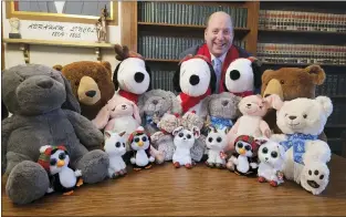  ?? SUBMITTED PHOTO ?? Attorney Andrew Edelberg shows the stuffed animals he donated to the Delaware County Criminal Investigat­ion Division and the Marple Police Department Tuesday.