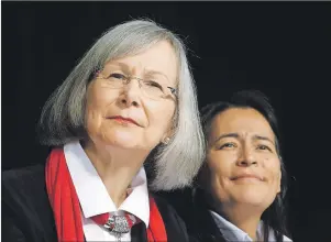  ?? CP PHOTO ?? Marion Buller (left), Chief Commission­er of the National Inquiry into Missing and Murdered Indigenous Women and Girls, along with her colleague, commission­er Michele Audette, hold a news conference in Ottawa on Tuesday.