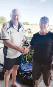  ??  ?? Iona captain Jeff Phillips (left) receives the Sportlande­r Trophy his side has tried to claim for many seasons now, finally beating Warrandyte.