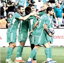  ?? (Maccabi Haifa/Courtesy) ?? MACCABI HAIFA players celebrate their goal early on in what held up as a 1-0 victory over Bnei Sakhnin this week in Israel Premier League action.