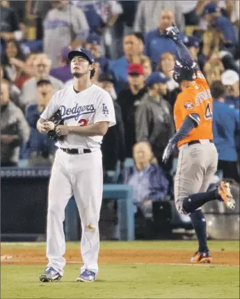  ?? Gina Ferazzi Los Angeles Times ?? YU DARVISH reacts to giving up a two-run homer to Houston’s George Springer, giving the Astros a 5-0 lead in the second inning of Game 7 of the 2017 World Series. He’s considered the goat of the series.