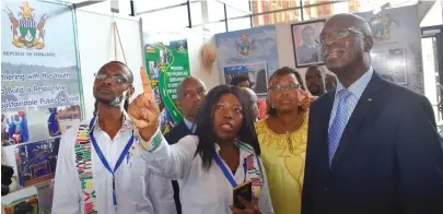  ??  ?? Members of the Zimbabwean delegation showing Rwandan Prime Minister Mr Anastase Murekezi some of the innovation­s which Zimbabwe has come up with in the public service