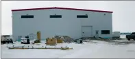  ?? -NEWS PHOTO GILLIAN SLADE ?? CanWest Air's hangar under constructi­on at Medicine Hat Airport. It has the contract to provide fixed-wing air ambulance service for most of the province, effective April 1. A judicial review recently sided with CanWest's allegation that the Town of...