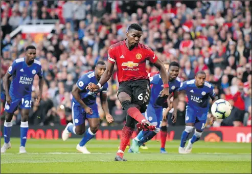  ?? — GETTY IMAGES ?? Manchester United’s Paul Pogba scores a goal on Friday, but it was his post-game comments that set off transfer talk.