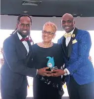  ??  ?? Paulette Bellamy receiving the Visionary Award from Ashe executives Michael Holgate (left) and Conroy Wilson.