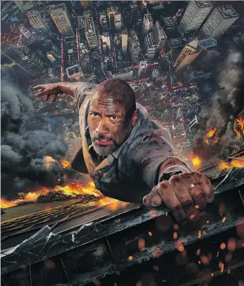  ?? UNIVERSAL STUDIOS ?? Dwayne Johnson hangs in there for his latest action blockbuste­r, Skyscraper, which hits theatres this week.