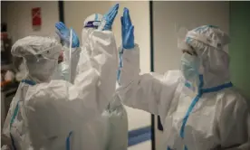  ?? Photograph: Domenico Stinellis/AP ?? ‘There was a buzz of intellectu­al excitement in the viral immunology field: a new virus, an unknown entity.’ Immunologi­sts at the San Camillo hospital in Rome.